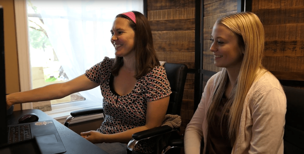 amber and emma on a zoom call at the office