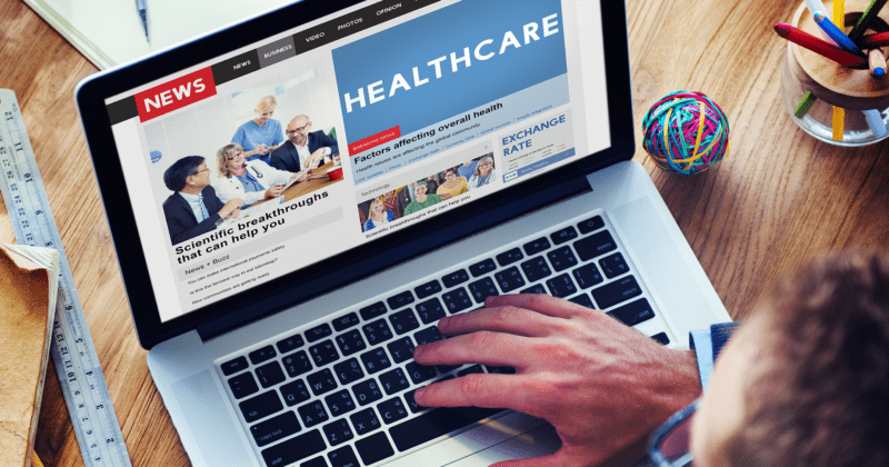 healthcare website on a laptop with news section