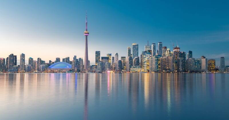 Toronto city skyline, Ontario, Canada looking across the water at buildings at dusk