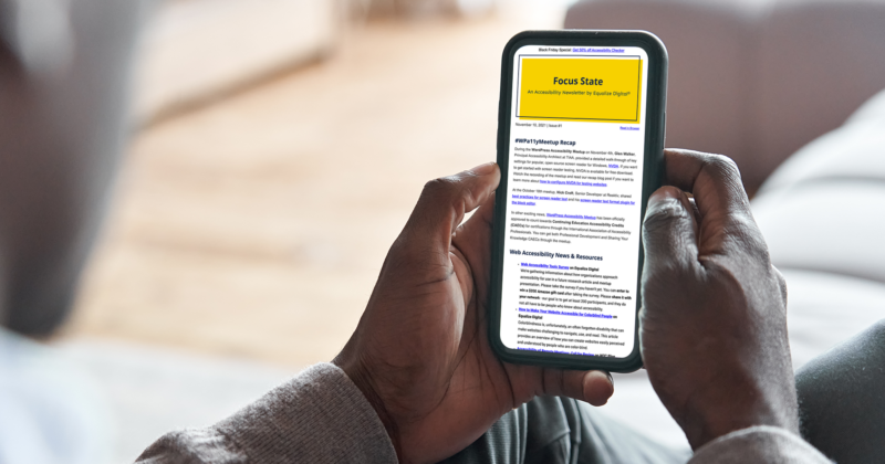 Black or African American man holding smart phone and reading the Focus State accessibility email newsletter