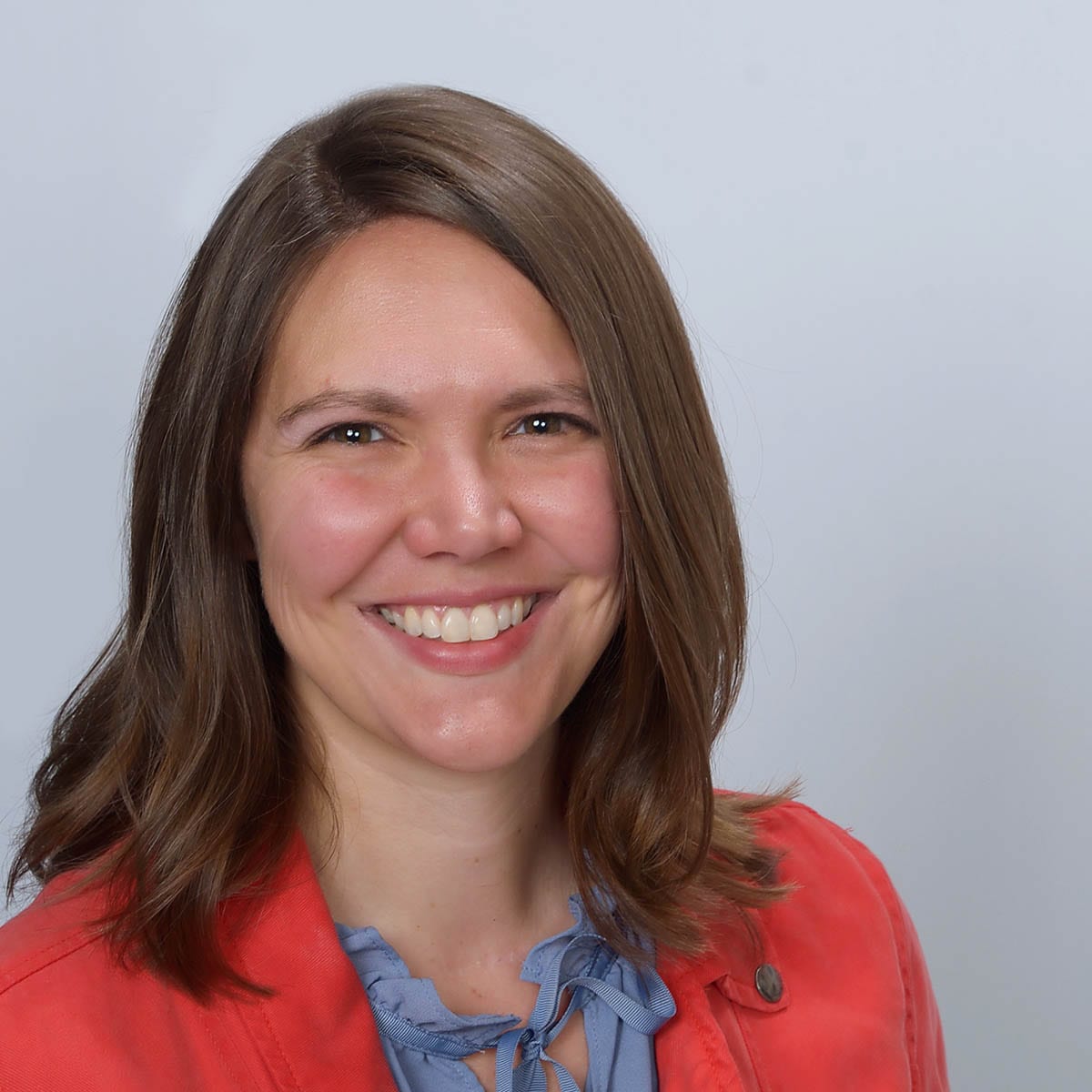 Amber Hinds is a white female in her 30's with shoulder length brown hair.