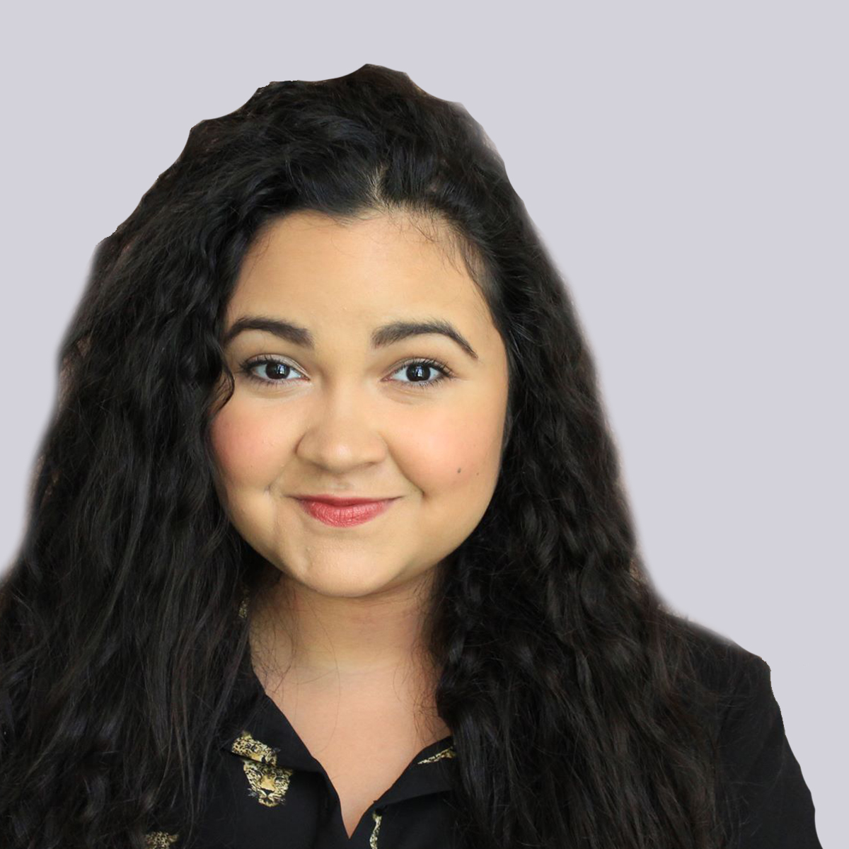 Paola is a young hispanic woman with wavy black hair.