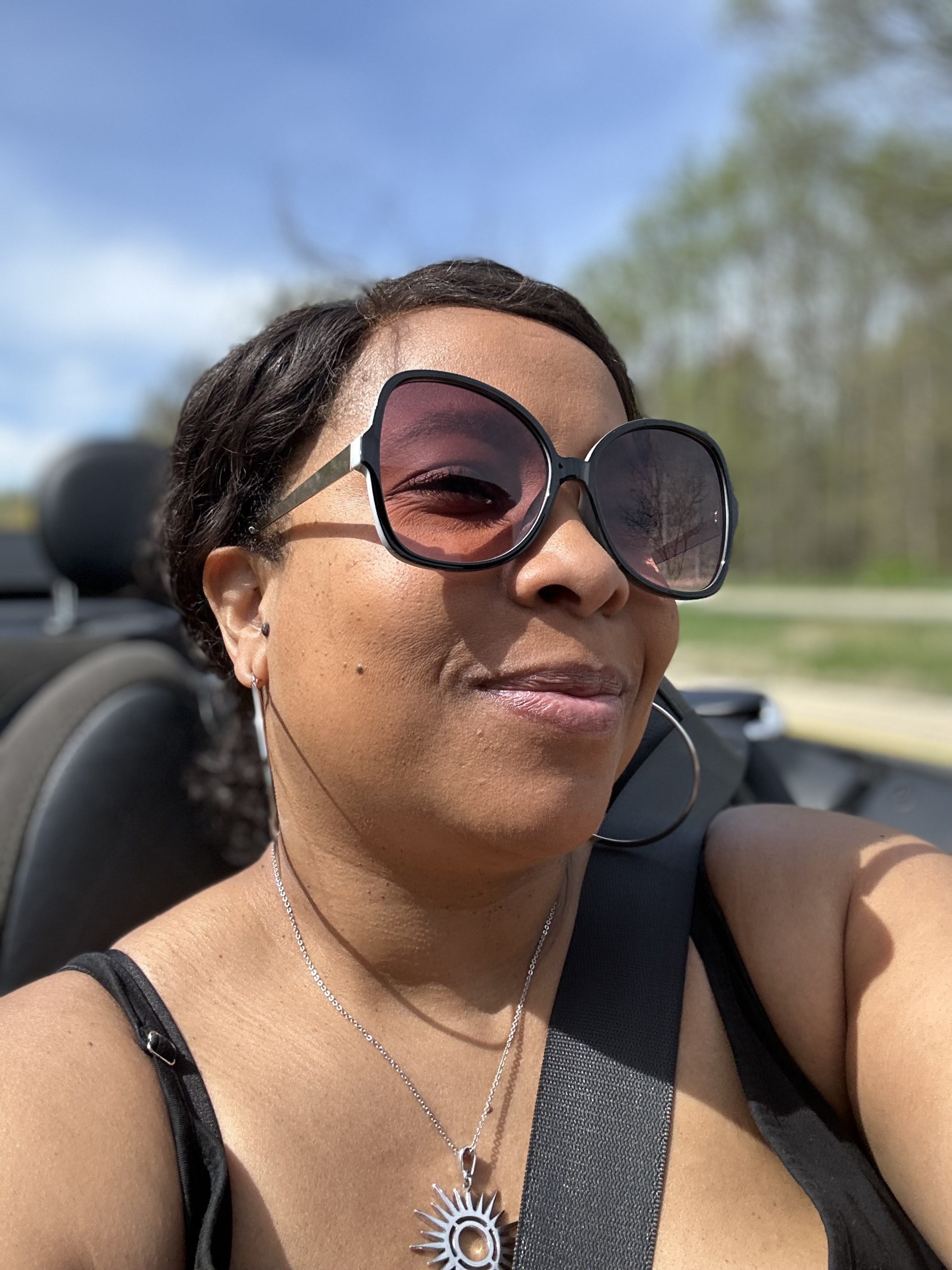 headshot of Burgundy riding in JARVIS with sunglasses